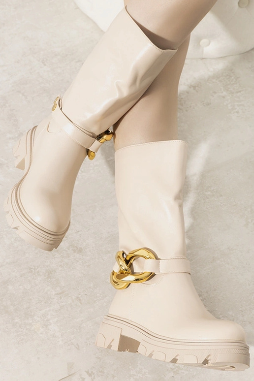 Bottines isolantes beiges avec chaîne... Bottines isolantes beiges avec chaîne...