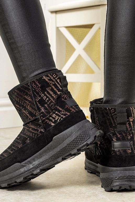 Bottes de neige noires et dorées pour... Bottes de neige noires et dorées pour...