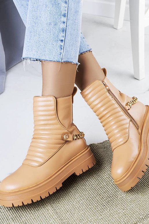 Bottines isolantes beiges avec chaîne... Bottines isolantes beiges avec chaîne...