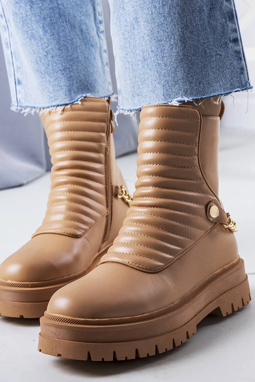 Bottines isolantes beiges avec chaîne... Bottines isolantes beiges avec chaîne...