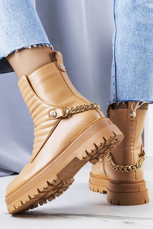 Bottines isolantes beiges avec chaîne... Bottines isolantes beiges avec chaîne...