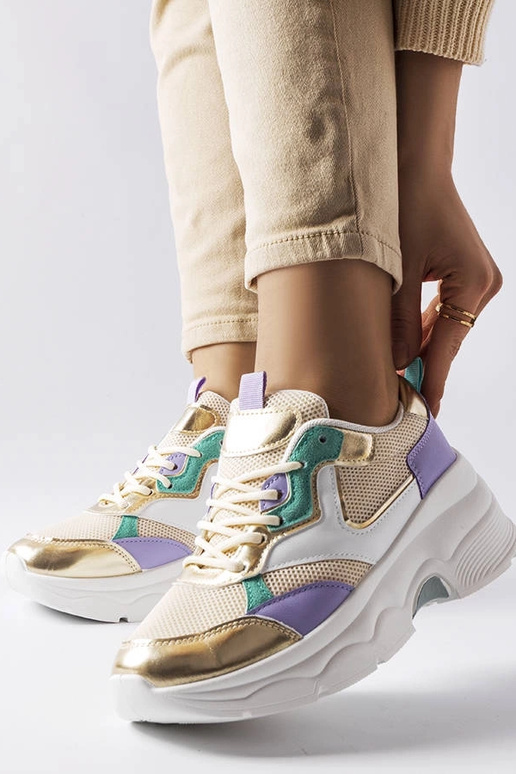 Baskets blanches et dorées pour femme... Baskets blanches et dorées pour femme...