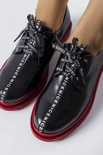 Bottines noires à semelle... 2