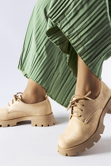 Bottines beiges à semelle... 2