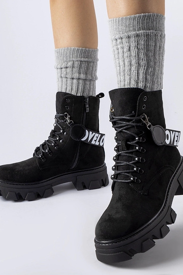 Bottines noires avec bride...