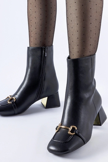 Bottines noires à boucle...