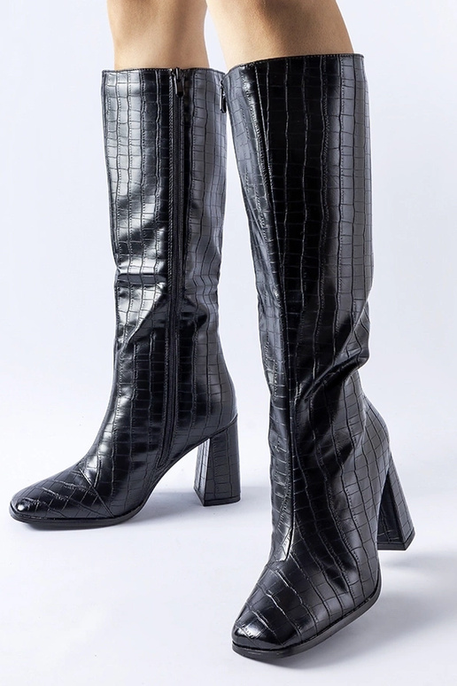 Bottes noires rembourrées à talon... Bottes noires rembourrées à talon...