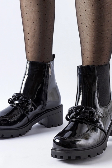 Bottes isolées en cuir verni noir avec boucle Leo