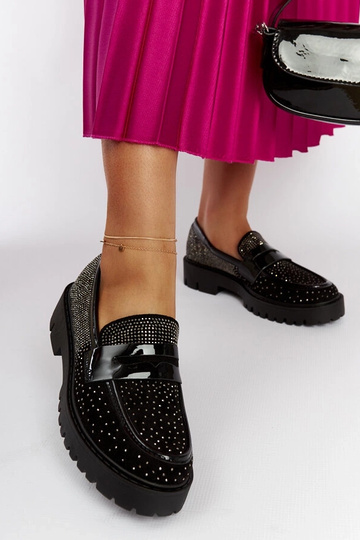 Mocassins noirs décorés de...