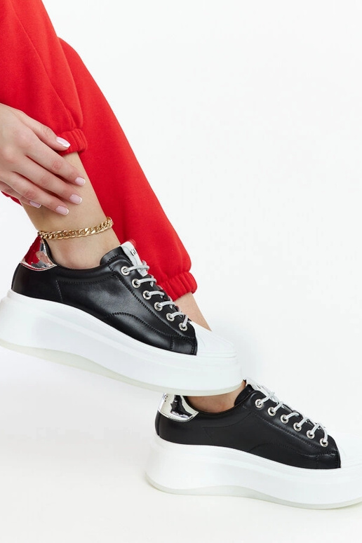 Bottines sneakers noires à plateforme... Bottines sneakers noires à plateforme...