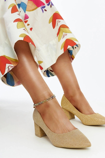 Ballerines à talon dorées...