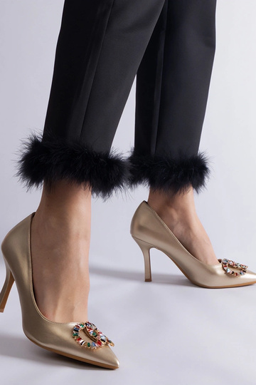 Escarpins dorés ornés de... 2