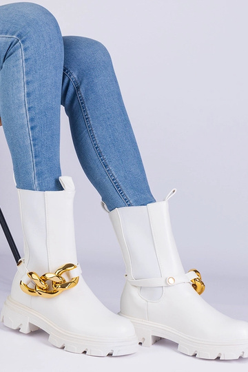 Bottines blanches ornées...