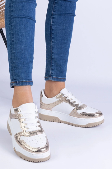 Baskets dorées à semelle... 2