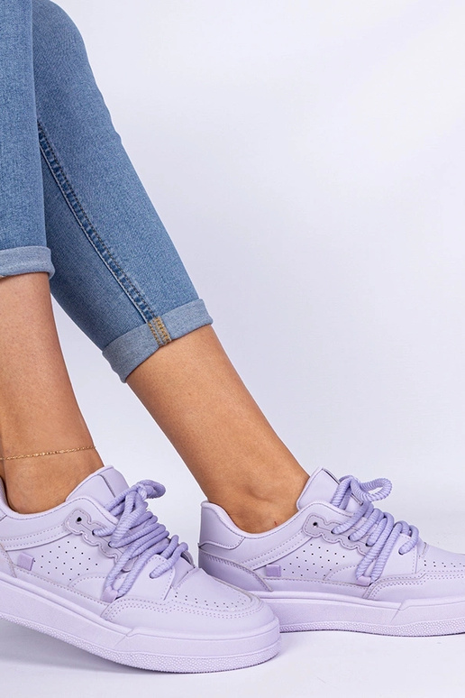 Sneakers sportives violettes pour... Sneakers sportives violettes pour...