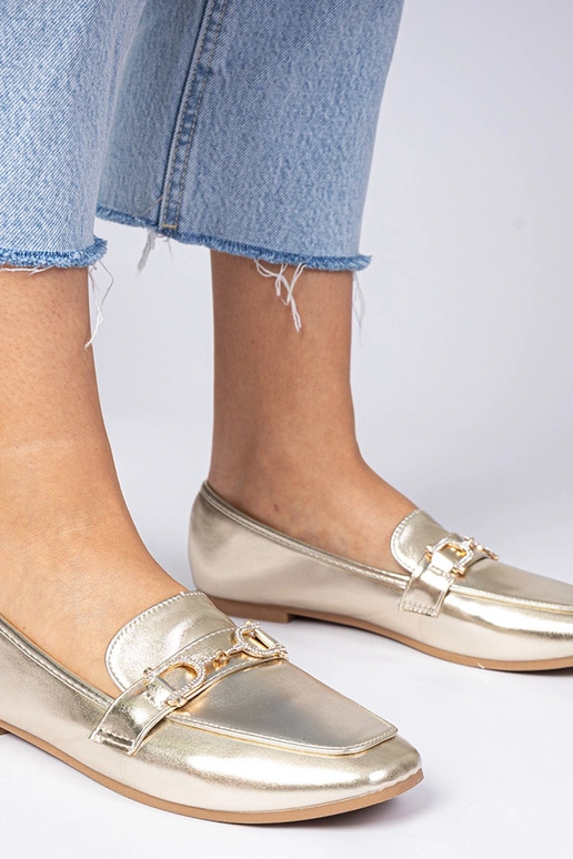 Mokasins dorés élégants avec... Mokasins dorés élégants avec...