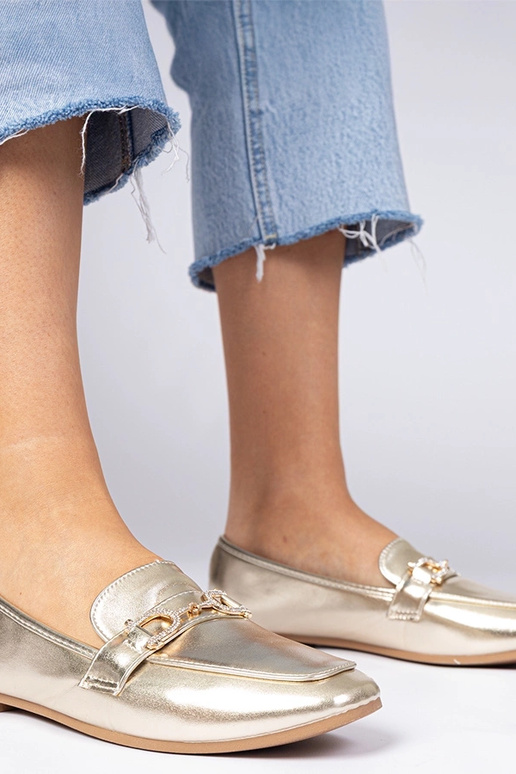 Mokasins dorés élégants avec... Mokasins dorés élégants avec...