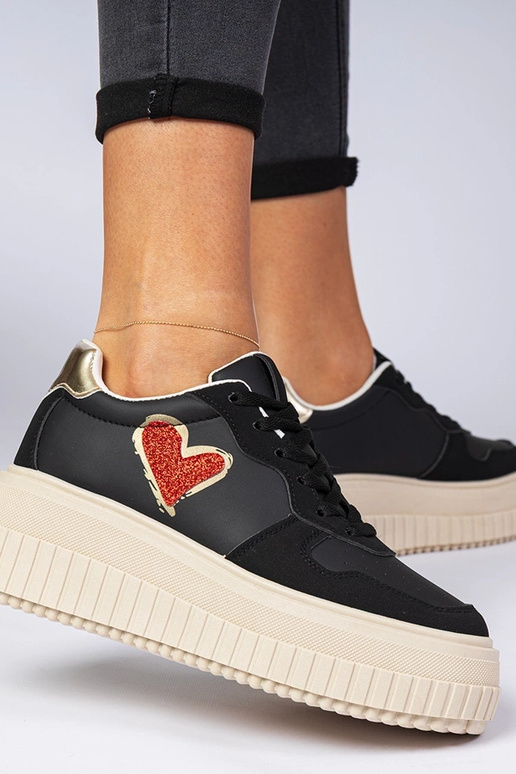 Baskets noires pour femmes avec un... Baskets noires pour femmes avec un...