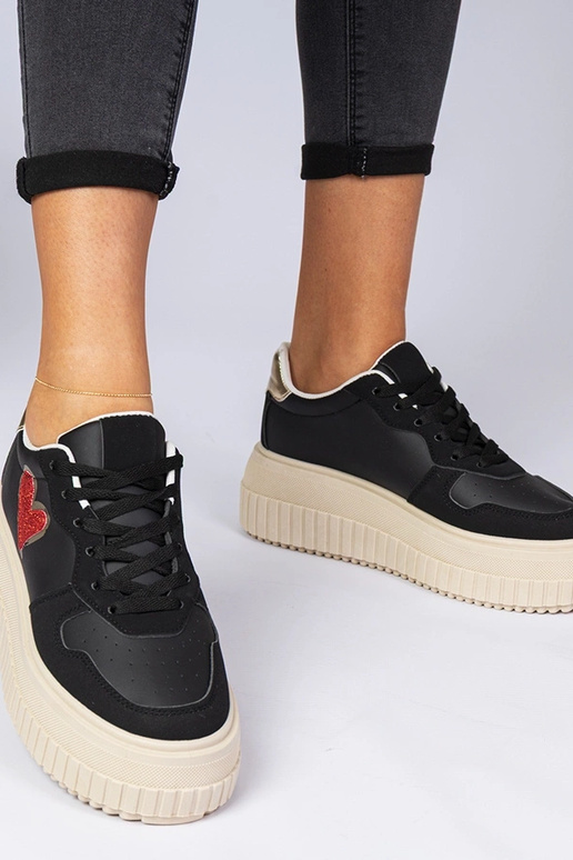 Baskets noires pour femmes avec un... Baskets noires pour femmes avec un...