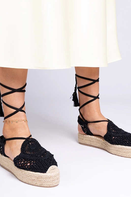 Sandales noires tressées à plateforme... Sandales noires tressées à plateforme...