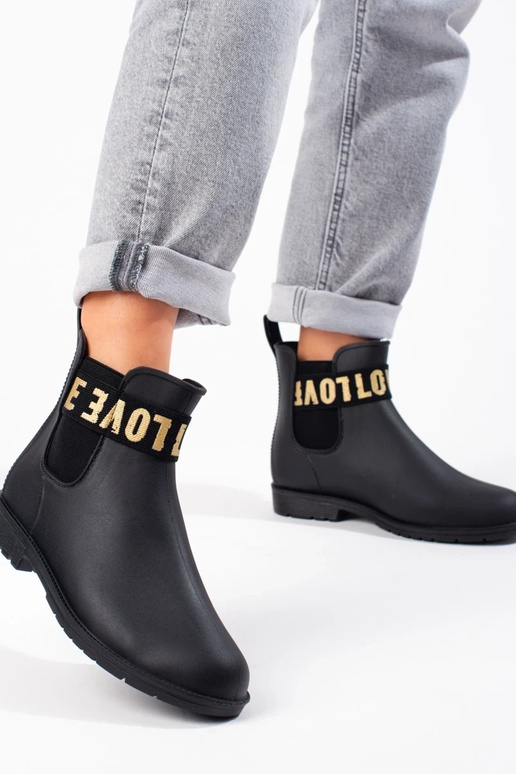 bottes courtes en caoutchouc noires... bottes courtes en caoutchouc noires...