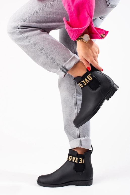 bottes courtes en caoutchouc noires... bottes courtes en caoutchouc noires...