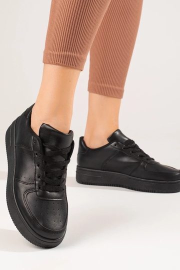 chaussures de sport noires... 2