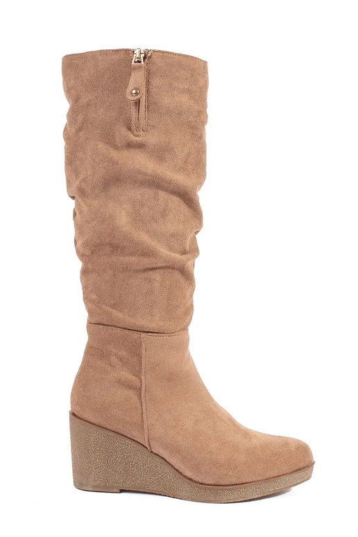 Bottes longues en daim beige sur...