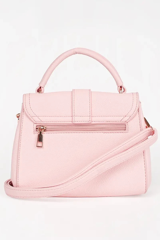 Petit sac rose vif avec des éléments...