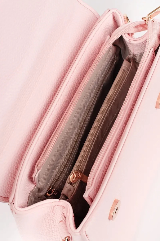 Petit sac rose vif avec des éléments...