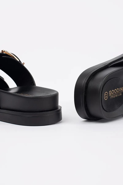 Mules plates noires avec boucles