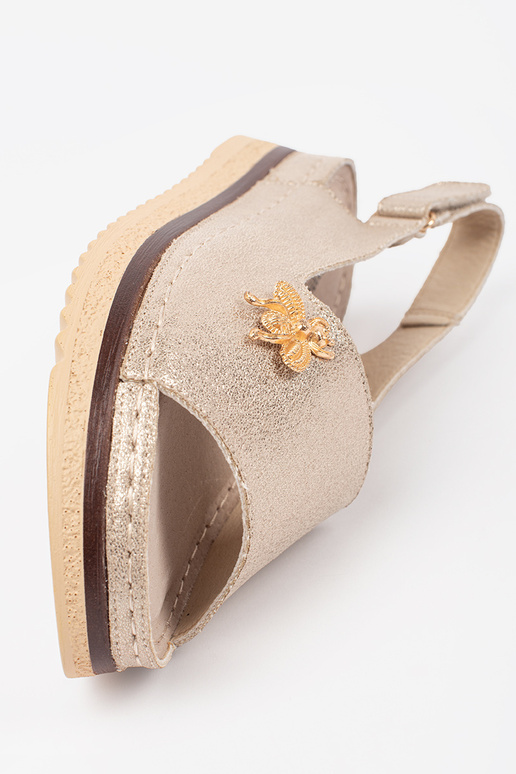 Sandales dorées avec plateforme et... Sandales dorées avec plateforme et...