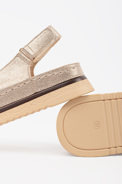 Sandales dorées avec plateforme et... Sandales dorées avec plateforme et...