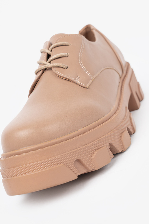 beige attaché demi-chaussures avec une plateforme