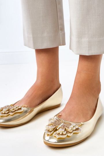 Ballerines dorées avec un...