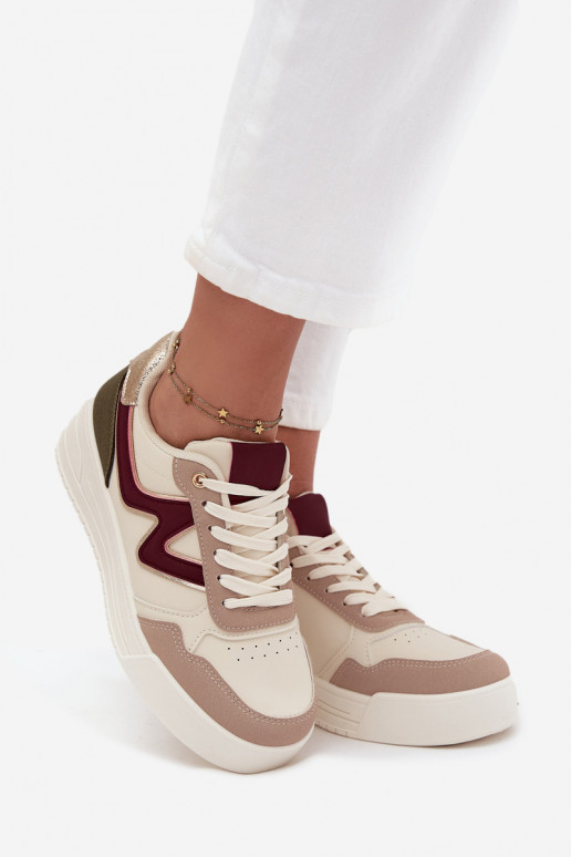 Chaussures modèle baskets Féminin avec une plateforme avec des détails dorés beige Zalvra