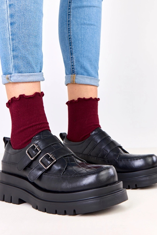 Bottines noires sur semelle massive,...