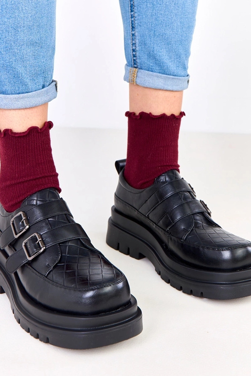 Bottines noires sur semelle massive,...