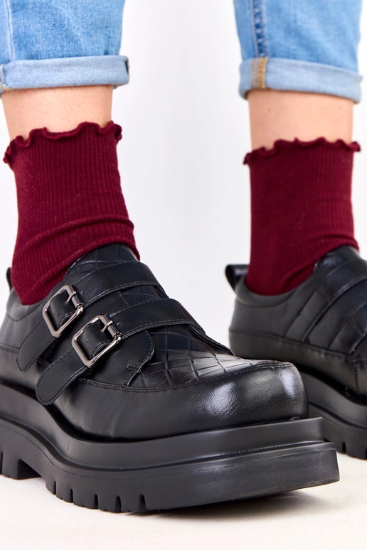 Bottines noires sur semelle massive,...