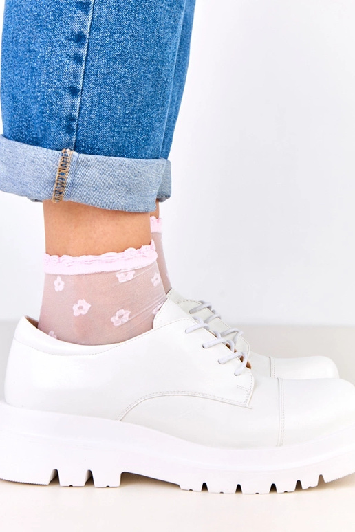 Bottines blanches sur semelle...