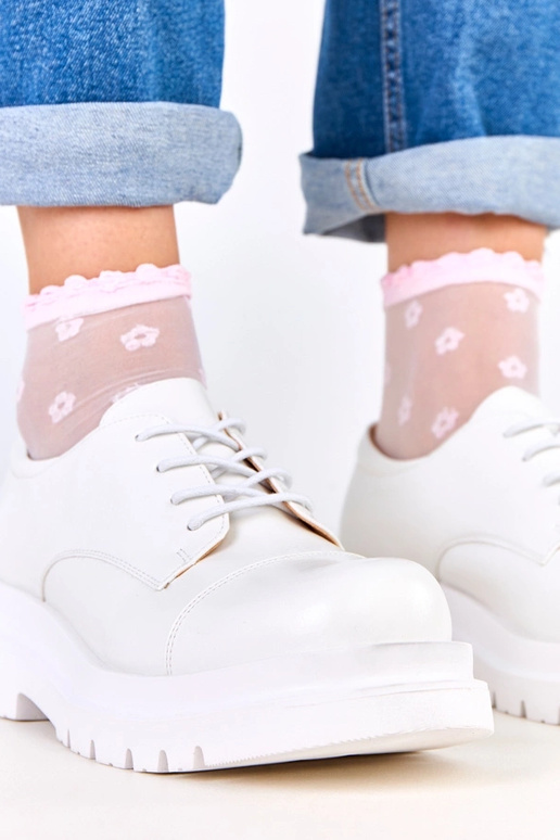 Bottines blanches sur semelle...