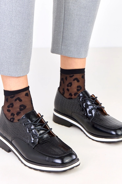 Bottines noires avec embossage et...