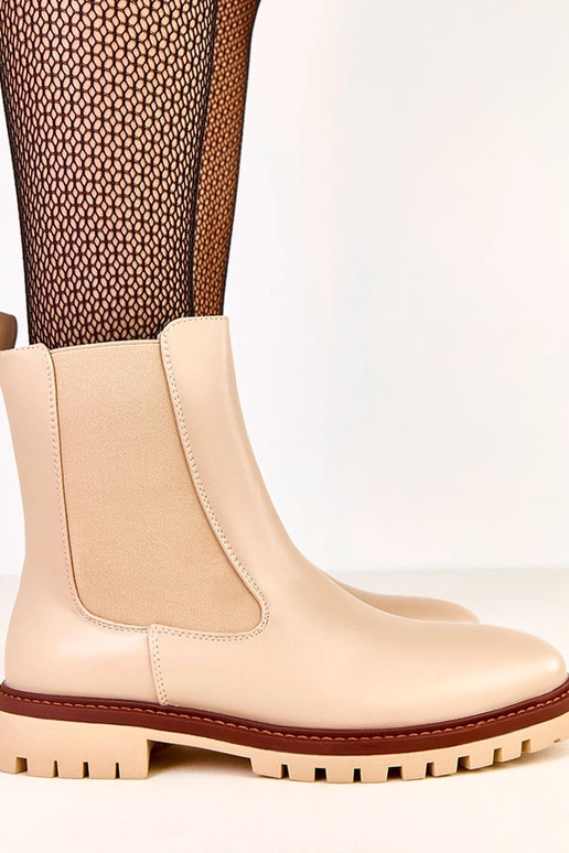 Bottines beige à semelle plate avec... Bottines beige à semelle plate avec...