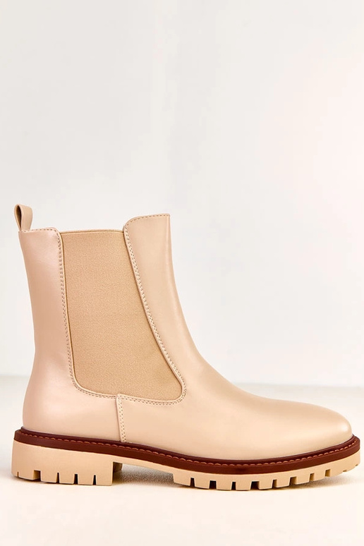 Bottines beige à semelle plate avec... Bottines beige à semelle plate avec...