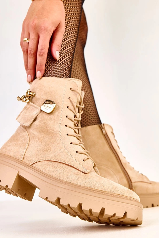 Bottes en toile beiges ornées d'un...