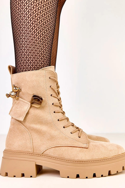 Bottes en toile beiges ornées d'un...