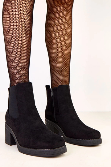 Bottines noires à talon bas...
