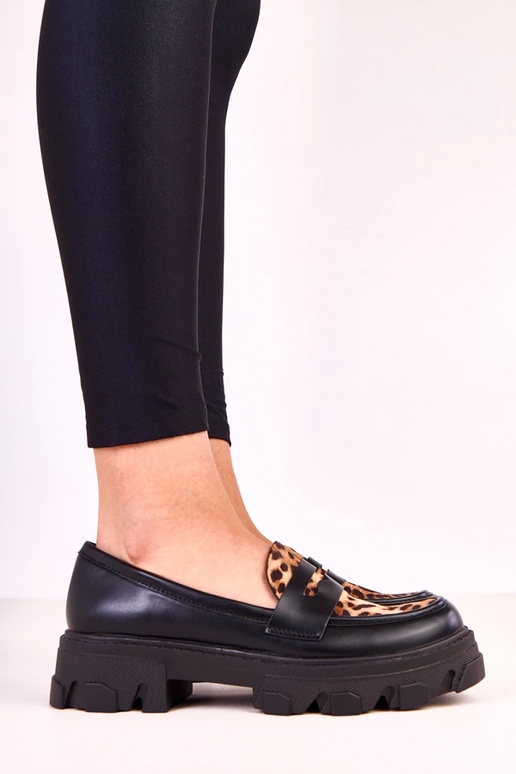 Mocassins noirs avec accent à motif...