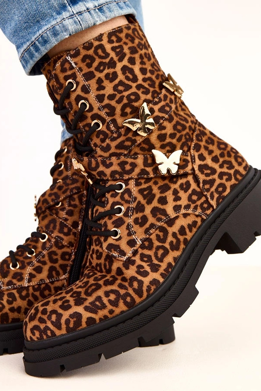 Bottines à motif léopard ornées de... Bottines à motif léopard ornées de...