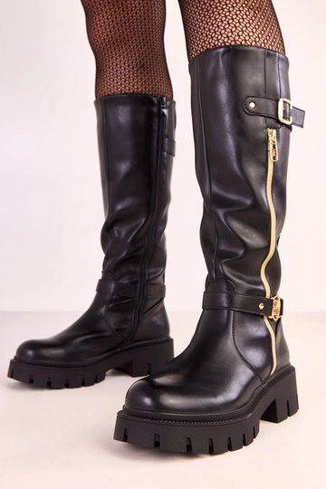 Bottes hautes noires sur plateforme avec décoration dorée Makia